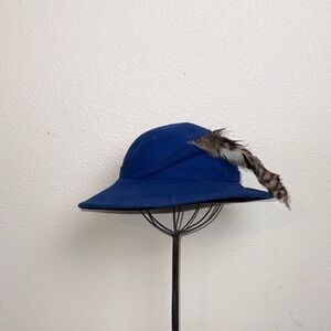 Vibrant Blue Hat with Red Ribbon Accent